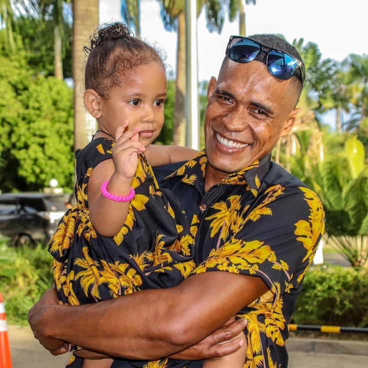 Aria Malik, Lead Design Curator at CyPressLogicLab, reviewing corporate floral arrangements